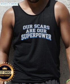 Alt Text: Model wearing 'Good Our Scars Are Our Superpower' tank top, showcasing a confident, empowering message on body positivity.