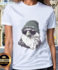 Alt Text: Philadelphia Eagles mascot in a beanie and sunglasses, showcasing team spirit on a ladies tee.