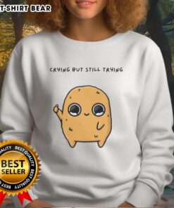 Alt Text: Cartoon mascot sweatshirt featuring a good-sad nuggie character crying but trying to smile, perfect for cozy outfits.