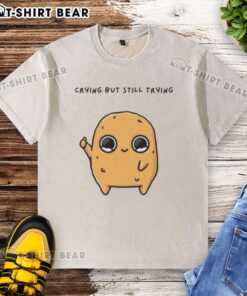 Alt Text: Good Sad Nuggie crying but trying mascot cartoon on a washed t-shirt, perfect for casual wear and expressing emotions.