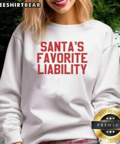 Funny political Christmas sweatshirt featuring 'Good Santa's Favorite Liability' design for holiday humor lovers.