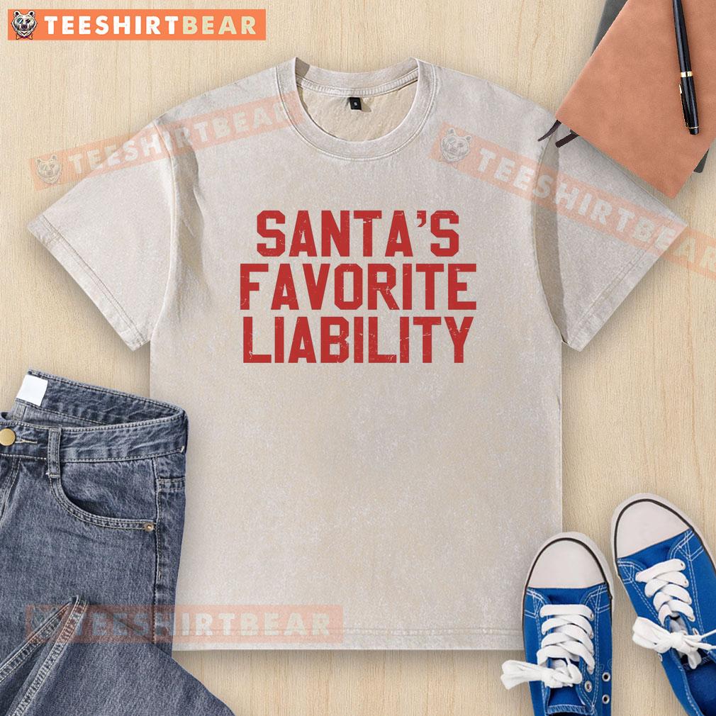 good-santas-favorite-liability-funny-political-christmas-washed-t-shirt Funny political Christmas t-shirt featuring 'Good Santa's Favorite Liability' design in a stylish wash for holiday cheer.