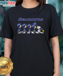 Good Seattle Seahawks X Peanuts Snoopy and Friends Abbey Road ladies tee featuring iconic characters and team colors.