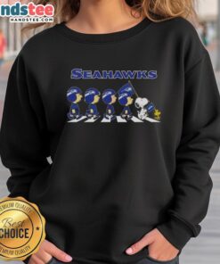 Good Seattle Seahawks X Peanuts Snoopy and Friends Abbey Road sweatshirt featuring iconic characters in team colors.