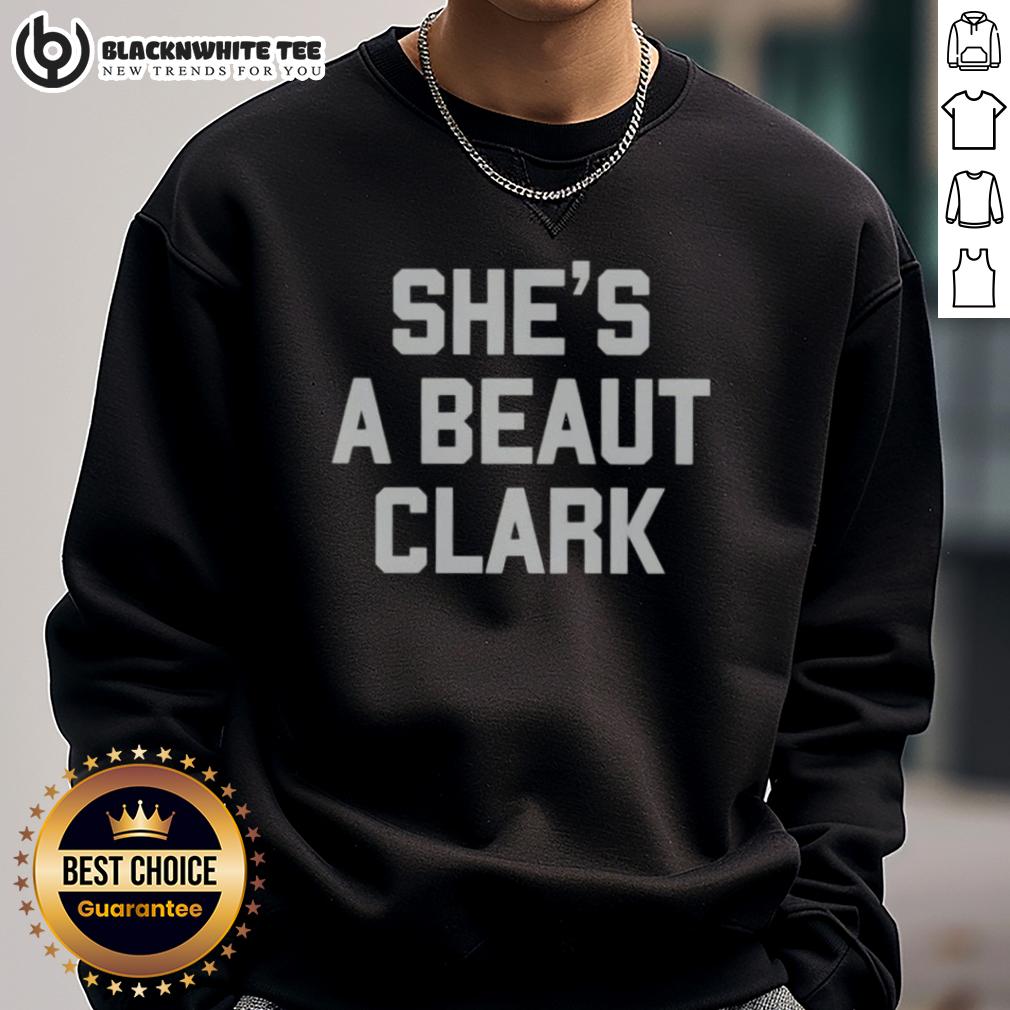 Good She'S A Beaut Clark Sweatshirt Model wearing a 'Good Shes A Beaut' Clark sweatshirt in a cozy setting, showcasing trendy fashion and comfort.