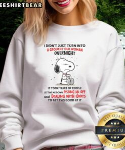 Alt Text: Good Snoopy sweatshirt featuring a humorous quote about aging, perfect for fans of vintage cartoon apparel.