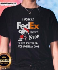 Good Snoopy Christmas tee for ladies with 'I work at FedEx, I don't stop when I'm tired, I stop when I'm done' slogan.