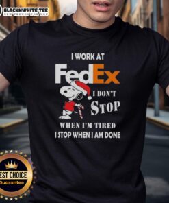 Good Snoopy Christmas T-Shirt featuring 'I Work At FedEx I Dont Stop When Im Tired I Stop When I Am Done' slogan.