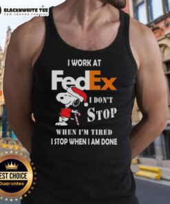 Festive tank top featuring Snoopy with 'I work at FedEx, I dont stop when Im tired, I stop when Im done' text.