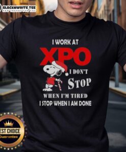 Good Snoopy Christmas T-Shirt featuring the phrase 'I Work At Xpo I Dont Stop When Im Tired I Stop When I Am Done'.