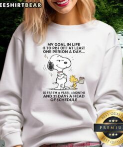 Good Snoopy sweatshirt with 'My goal in life is to piss off at least one person a day' graphic design
