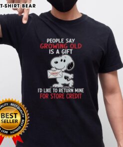 Funny Snoopy t-shirt with 'Growing Old Is A Gift, I'd Like To Return Mine for Store Credit' design, perfect for humor lovers.