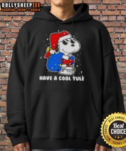 Good Snoopy in a Santa hat on a Merry Christmas hoodie, perfect for celebrating the holiday season with a cool yule vibe.