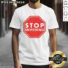 Good Stop Snitching T-Shirt featuring bold text design, perfect for making a statement in streetwear fashion.