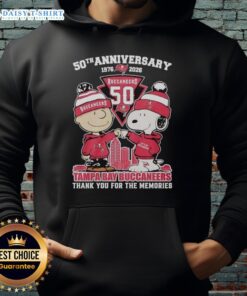 Alt Text: Stylish Tampa Bay Buccaneers hoodie featuring Snoopy and Charlie Brown for the 50th Anniversary, 1976-2026.