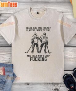 Funny washed t-shirt featuring 'Two Hockey Players Inside You' graphic, perfect for hockey fans and casual wear.