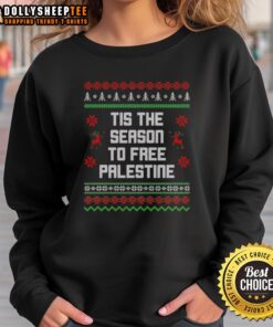 Good Tis The Season To Free Palestine sweatshirt featuring bold text and festive colors promoting awareness and solidarity.