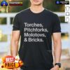 Good Torches Pitchforks Molotovs And Bricks 2025 World Tour T-Shirt featuring vibrant graphics and tour dates.