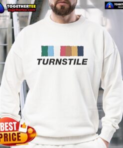 Good Turnstile band sweatshirt in vibrant colors against a wall, perfect for fans of the Sept 2025 music scene.