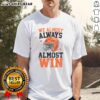 Funny football fan T-shirt with 'Good We Almost Always Almost Win' slogan, perfect for sports enthusiasts and game day.