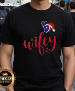 Alt Text: Good Wifey Houston Texans Santa Hat Merry Christmas T-Shirt featuring festive design for holiday football fans.