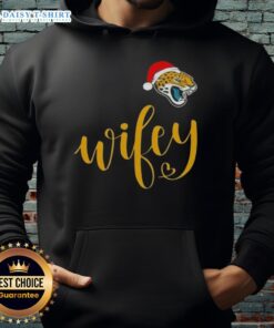 Good Wifey Jacksonville Jaguars Santa Hat Merry Christmas Hoodie worn by a fan, showcasing team spirit and holiday cheer.
