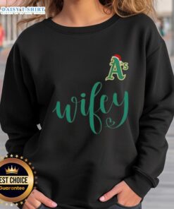 Good Wifey Oakland Athletics Santa Hat Merry Christmas Sweatshirt featuring festive design and team logo for holiday cheer.