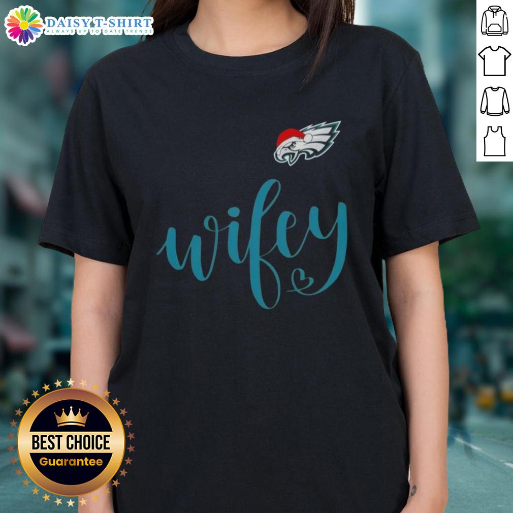 Good Wifey Philadelphia Eagles Santa Hat Merry Christmas Ladies Tee Good Wifey Philadelphia Eagles Santa Hat Merry Christmas Ladies Tee in festive green with holiday graphics.