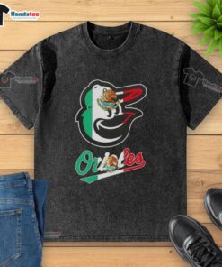 Alt Text: Happy Baltimore Orioles baseball fan wearing a washed t-shirt featuring the Mexican flag design.