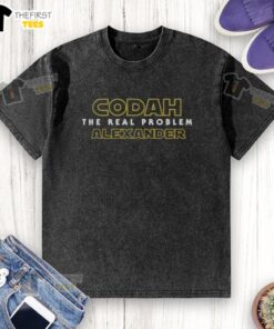 Alt Text: Happy Codah wearing 'The Real Problem' Alexander Washed T-Shirt, showcasing a trendy casual style and vibrant colors.