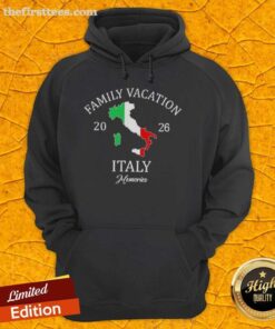 Happy family wearing matching 'Family Travel Squad' hoodies enjoying a vacation in Italy, 2026.