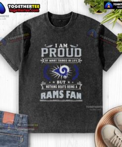 Happy Los Angeles Rams fan wearing a proud, washed T-shirt celebrating team spirit and loyalty.