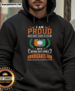 Happy Miami Hurricanes fan wearing a proud hoodie, celebrating their love for the team and school spirit.