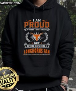 Alt Text: Happy fan wearing a Texas Longhorns hoodie, expressing pride in being a Texas Longhorns fan.