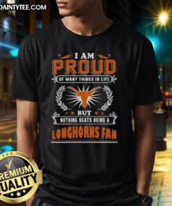 Happy Texas Longhorns fan wearing a 'Proud Of Many Things' T-shirt, showcasing team spirit and pride in Texas football.