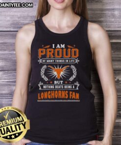 Happy fan in a Texas Longhorns tank top, proudly showcasing their love for the team and Texas spirit.