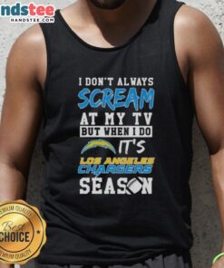 Alt Text: Happy fan wearing a Los Angeles Chargers season tank top, showcasing team spirit while watching a game.