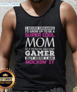 Alt Text: Happy mom wearing a 'Super Cool Mom of a Freaking Awesome Gamer' tank top, showcasing her pride in gaming culture.