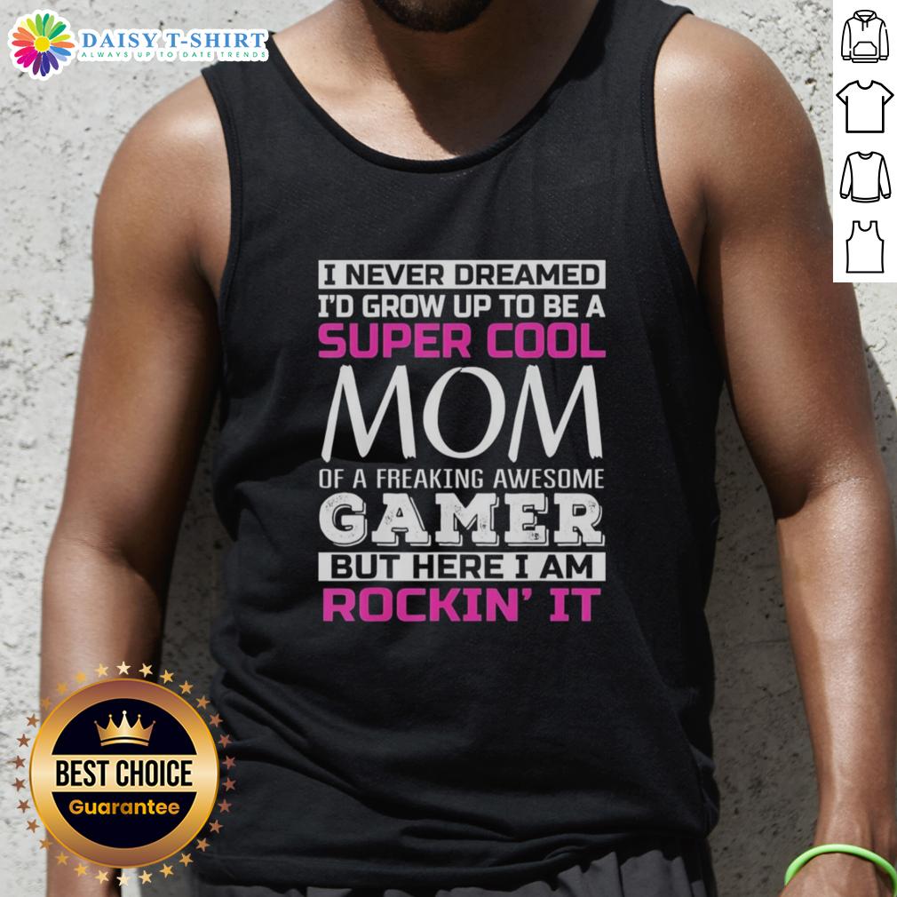 Happy I Never Dreamed I'd Grow Up To Be A Super Cool Mom Of A Freaking Awesome Gamer Tank Top Alt Text: Happy mom wearing a 'Super Cool Mom of a Freaking Awesome Gamer' tank top, showcasing her pride in gaming culture.
