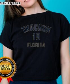 Alt Text: Happy Matthew Tkachuk wearing a Florida Panthers Ladies Tee with name and number 19, celebrating ice hockey.