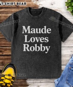 Happy Maude wearing a washed t-shirt, showing love for Robby in a vibrant outdoor setting.