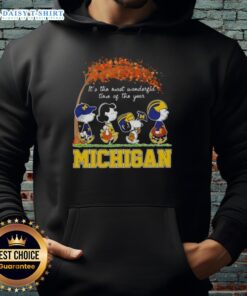 Happy Michigan Wolverines X Peanuts Snoopy hoodie featuring autumn themes, perfect for celebrating the season.