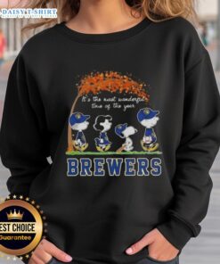 Cozy sweatshirt featuring Milwaukee Brewers, Snoopy, and friends celebrating autumn in a festive design.