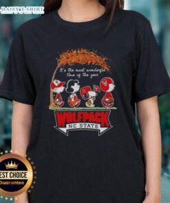 Happy NC State Wolfpack tee featuring Peanuts Snoopy and friends, perfect for autumn celebrations and holiday cheer.