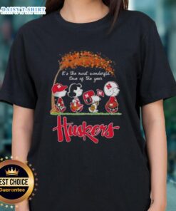 Happy Nebraska Cornhuskers tee featuring Snoopy and friends celebrating autumn, perfect for the most wonderful time of the year.