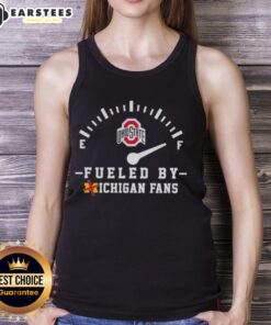 Happy Ohio State Buckeyes fans wearing a tank top, showing team spirit and excitement for the game against Michigan.