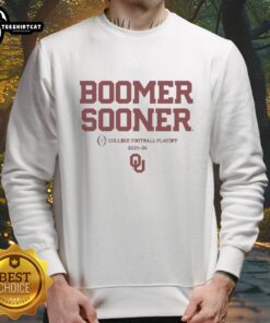 Alt Text: Happy Oklahoma Sooners Football Boomer Sooner 2025-2026 CFP sweatshirt featuring team colors and logo.