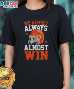 Funny football fan ladies tee featuring 'Happy We Almost Always Almost Win' slogan, perfect for game day spirit.
