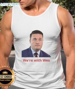 Happy Wes wearing a stylish 'We're With Wes' tank top, showcasing a fun and vibrant street style.