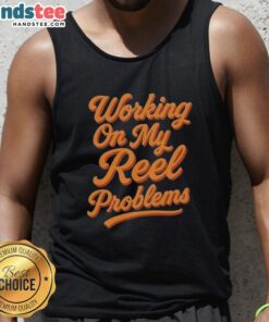 Happy person wearing a fishing tank top, working on reel problems with a smile, showcasing a love for fishing.